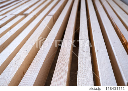 Construction wood laths, parallel arrangement for frame, decorating, repairing, crate, partition, wall elements, professional building component, interior fitout. 138435331