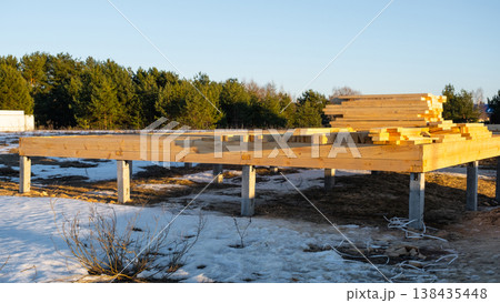 Foundation base with wooden beams, site preparation for house frame, timber construction, assembly stage, outdoor project, carpentry, new build foundation. 138435448
