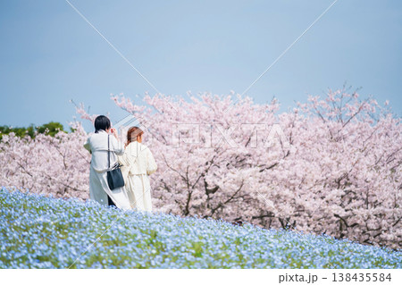 LGBTQ couple at hill view Nemophila and sakura, Fukuoka 138435584