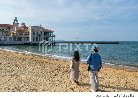 Japanese couple on beach to view Marizon wedding hall, Fukuoka Japanese couple on beach to view Marizon wedding hall, Fukuoka 138435593
