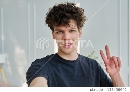 Selfie portrait happy handsome young man looking at camera Selfie portrait happy handsome young man looking at camera 138436642