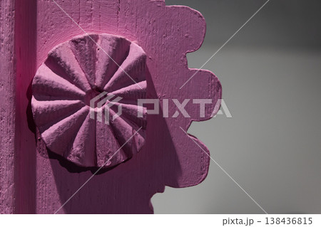 Close-up of a pink painted wooden rosette Close-up of a pink painted wooden rosette 138436815