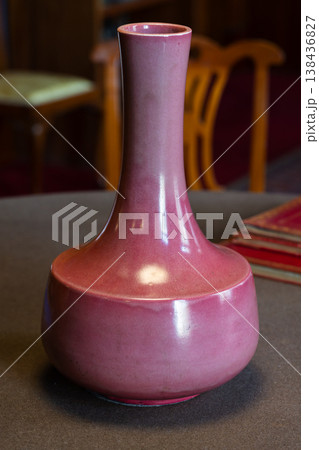 Glossy pink ceramic vase with a narrow neck Glossy pink ceramic vase with a narrow neck 138436827