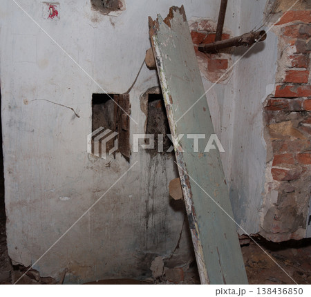 Dilapidated Interior Wall With Exposed Brick And Rusty Pipes In Abandoned Building Showing Decay And Neglect With Peeling Paint And Broken Surface Textures Dilapidated Interior Wall With Exposed Brick And Rusty Pipes In Abandoned Building Showing Decay And Neglect With Peeling Paint And Broken Surface Textures 138436850