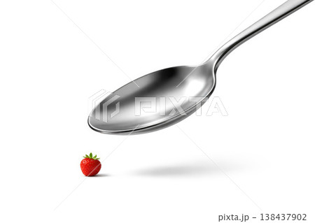 A huge metal spoon over a small strawberry. Space for text. 138437902