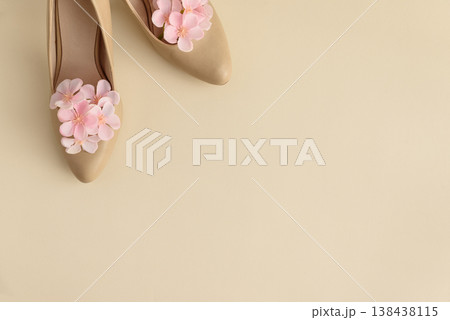 Beige High Heels with Pink Flowers on Cream Background. Beige High Heels with Pink Flowers on Cream Background. 138438115