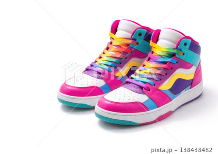 A pair of bright high sneakers with multi-colored laces on a white background. Space for text. 138438482