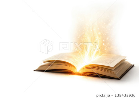 An open book with a golden glow on a white background. Space for text. 138438936