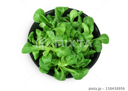 Valerian leaves salad. Corn salad in ceramic bowl isolated on white backgrounds. Lettuce salad. Top view Valerian leaves salad. Corn salad in ceramic bowl isolated on white backgrounds. Lettuce salad. Top view 138438956