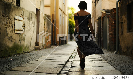Attractive Young Woman Walks Through The Historical Part Of A European City, Happy Girl Tourist Enjoys Sightseeing In The Center 138439428