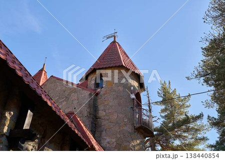 Pine Silhouettes Under Blue Sky. Vertical Perspective Of Monument With Cross And Pine Silhouettes Pine Silhouettes Under Blue Sky. Vertical Perspective Of Monument With Cross And Pine Silhouettes 138440854
