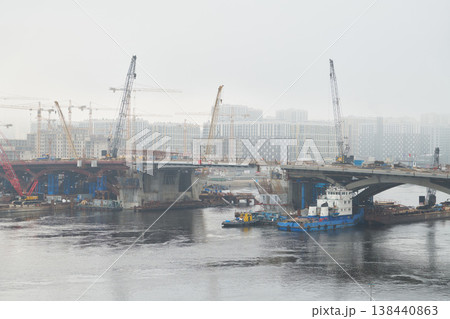 Building bridge spans with heavy lifting equipment present Building bridge spans with heavy lifting equipment present 138440863