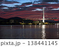 気仙沼湾の夕焼けと欠けた月の水辺の風景 138441145