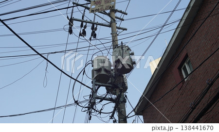 Electric pole and transformers in a residential area in Seoul, Korea. Electric pole and transformers in a residential area in Seoul, Korea. 138441670