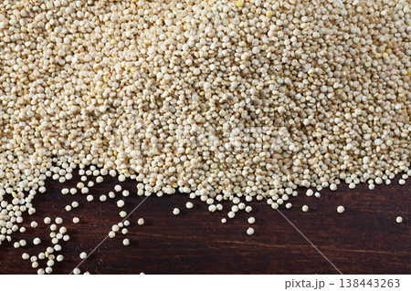 Natural background of quinoa seeds on wood surface Natural background of quinoa seeds on wood surface 138443263