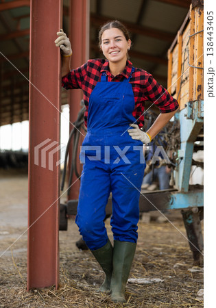 Young female worker posing on farm 138443405