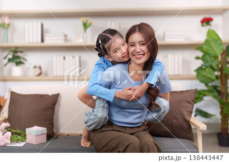 Mother and daughter enjoying playful time together 138443447