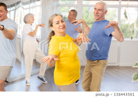 Couple of elderly man and woman dancing twist Couple of elderly man and woman dancing twist 138443501