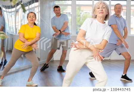 Elderly woman dances modern dances in group Elderly woman dances modern dances in group 138443745
