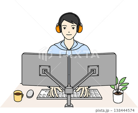 聴覚過敏のためイヤーマフを装着してPC作業に集中する男性 138444574