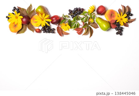 Autumn fruits apples pears grapes fallen leaves lined with frame white background. Thanksgiving harvest concept 138445046