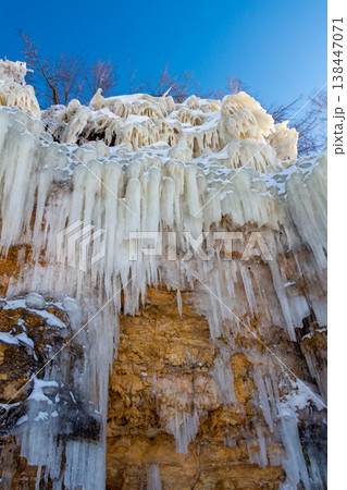 Icicles on the rocks 138447071