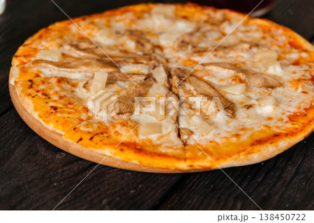 Pizza with chicken, pineapple and cheese. Pizza close-up. Pizza with chicken, pineapple and cheese. Pizza close-up. 138450722