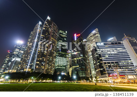 Night view of the Marina Bay Financial Centre and the Raffles Place modern office skyscrapers along Marina Bay in Singapore. Night view of the Marina Bay Financial Centre and the Raffles Place modern office skyscrapers along Marina Bay in Singapore. 138451139