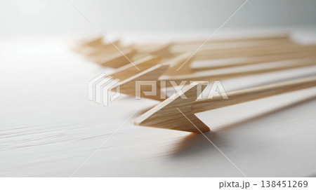 A row of wooden arrows lined up parallel on a light background, representing direction, strategy, leadership, focus on a goal, forward movement, and choice of path. 138451269