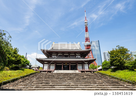 Building view of the Zojo-ji Hondo (main hall) with the Tokyo Tower in Minato, Tokyo, Japan, which is a Jodo-shu Buddhist temple. 138451619