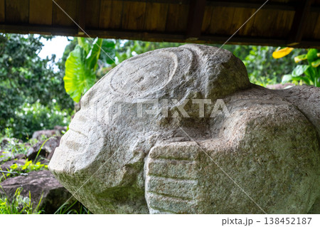 Stone sculpture of a birthing woman at Te Lipona, Hiva Oa, French Polynesia 138452187