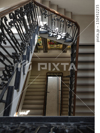 the geometric grace of the staircase within the Tunbridge Wells Town Hall, where the rhythmic descent of stone steps creates a mesmerizing sense of depth. The wrought-iron balustrades, adorned with the geometric grace of the staircase within the Tunbridge Wells Town Hall, where the rhythmic descent of stone steps creates a mesmerizing sense of depth. The wrought-iron balustrades, adorned with 138452235