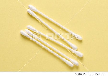 Cotton swabs for hygiene. Yellow background. 138454190