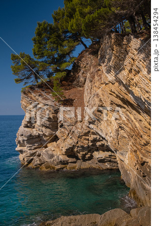 Scenic panorama of Budva Riviera with steep cliffs lush Mediterranean vegetation and clear turquoise waves along coast Scenic panorama of Budva Riviera with steep cliffs lush Mediterranean vegetation and clear turquoise waves along coast 138454294