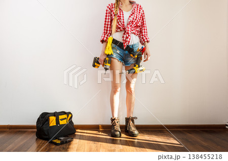 Woman wearing protective workwear Woman wearing protective workwear 138455218