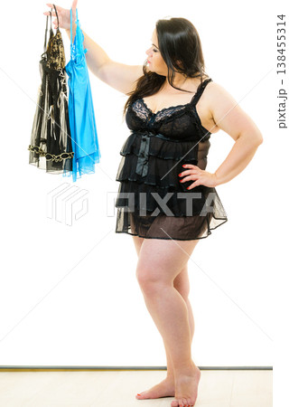 Plus size woman fitting satin nightwear 138455314