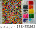 Close up of colorful seed beads in square sections pink shades, flat lay 138455862