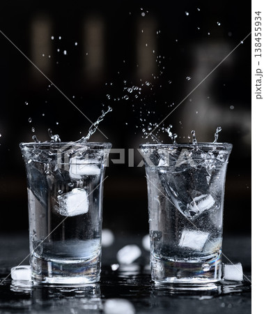 vodka shots splash with ice vodka shots splash with ice 138455934