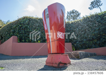 Red automatic parking barrier control post on urban street access system security bollard equipment 138457606