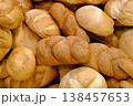 Various types of white wheat bread - loaves, baguettes, buns, rolls 138457653