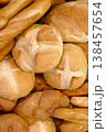 Various types of white wheat bread - loaves, baguettes, buns, rolls 138457654
