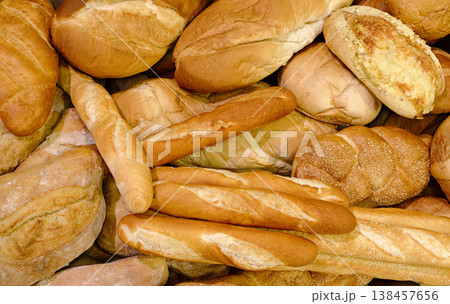 Various types of white wheat bread - loaves, baguettes, buns, rolls 138457656