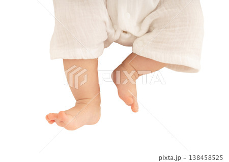 Tiny baby feet are gently dangling in the air, isolated, PNG Tiny baby feet are gently dangling in the air, isolated, PNG 138458525