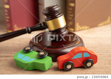 Car accident lawsuit and insurance, Judge hammer with car model. Car accident lawsuit and insurance, Judge hammer with car model. 138458964