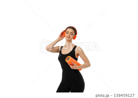 Yoga session with a young woman using foam roller, PNG 138459127