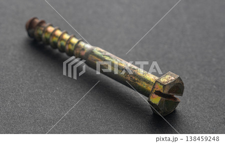 Construction screw close-up on a black background Construction screw close-up on a black background 138459248