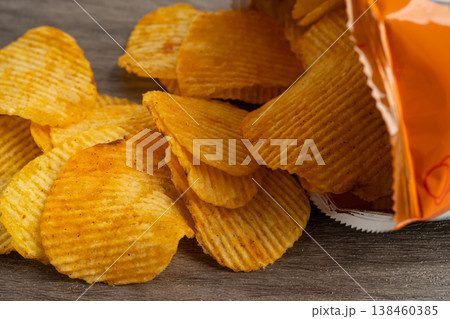 Potato chips , delicious BBQ seasoning spicy for crips, thin slice deep fried snack fast food. Potato chips , delicious BBQ seasoning spicy for crips, thin slice deep fried snack fast food. 138460385