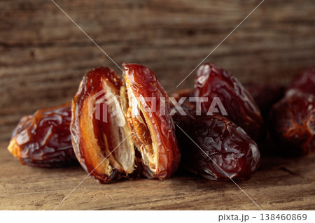 Dates fruit on an old wooden table. 138460869