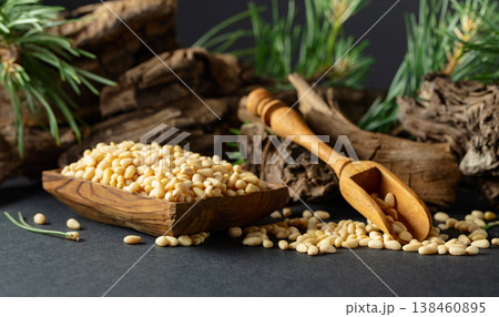 Peeled pine nuts with cedar dried snags and green branches. Peeled pine nuts with cedar dried snags and green branches. 138460895