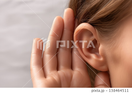 Woman Holding Hand to Her Ear to Listen Better Woman Holding Hand to Her Ear to Listen Better 138464511